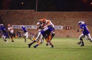 Conner Howard delivers a big tackle in last year's 62-0 win in Guthrie.